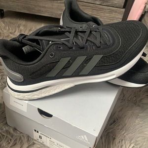 Black Adidas Supernova Sneakers